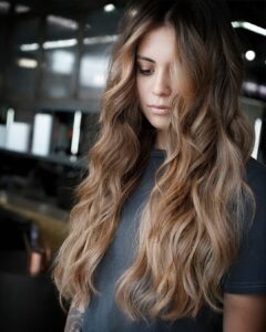 Woman with heavy balayage and bold money piece