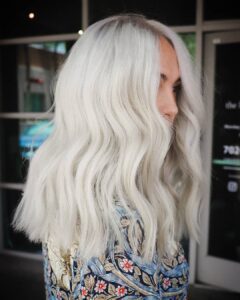Woman with mid length platnium blonde hair