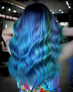 Woman with mermaid blue and green hair