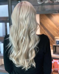 Woman with platnium blonde extensions