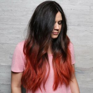 Woman with bright red fantasy color ends