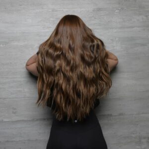 Woman with dimensional brunette extensions