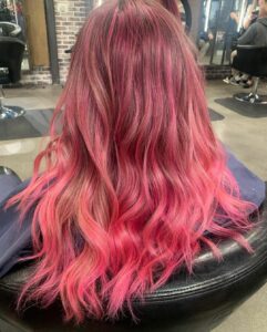 Woman with fantasy color pink hair