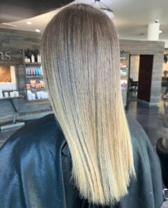 Woman with a stunning lived in balayage blow out