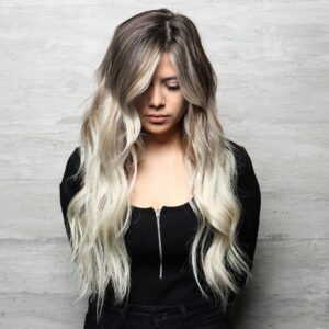 Woman with a blonde balayage and hair extensions