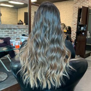 Woman with brunette hair and a blonde balayage