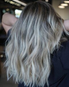 Woman with a blonde balayage and highlights