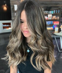 Woman with a dark brunette dimensional balayage