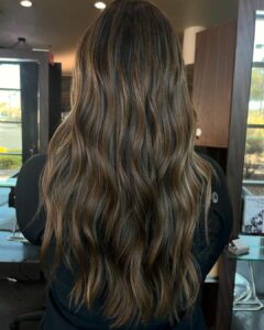 Woman with a dimensional brunette balayage look