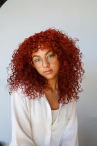 Woman with big red curls