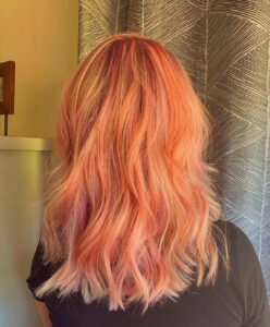 Woman with a mermaid peach fantasy color service